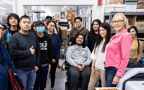 an, the founder of Tradeworks USA, smiling with a group of students at RCC - ADM