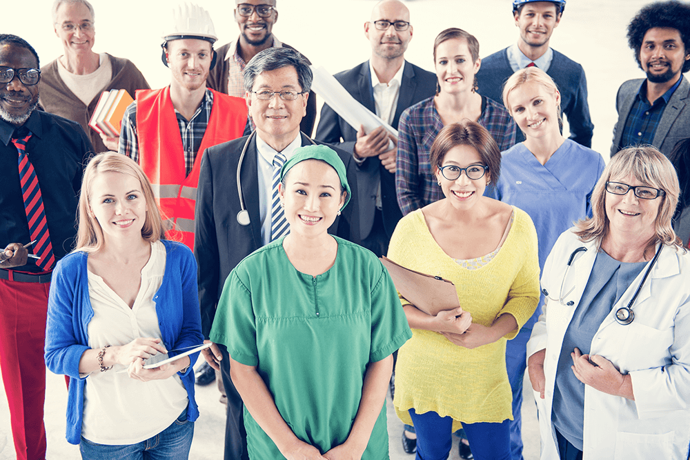 Group of diverse individuals in different professions smiling joyfully together in a vibrant setting.